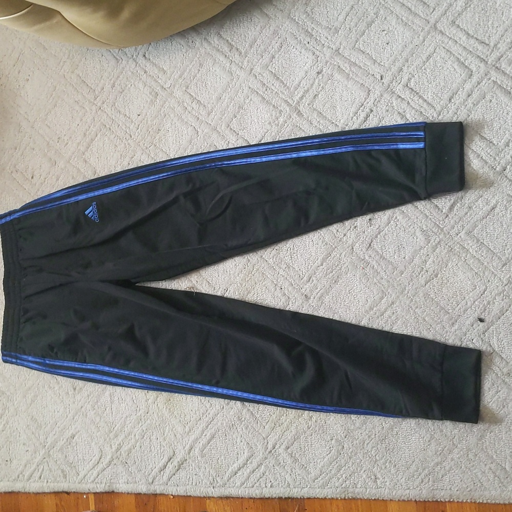 blue and black Adidas sweatpants